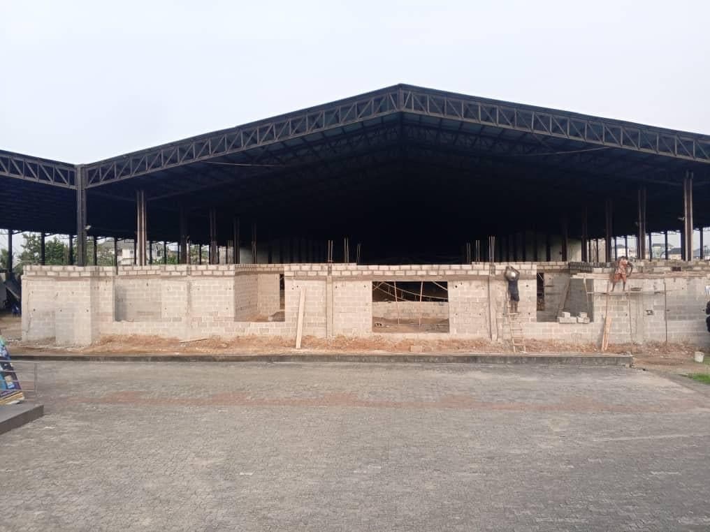 Steel roof and block walls rising at the International Convention Grounds, Airport Road, Port Harcourt